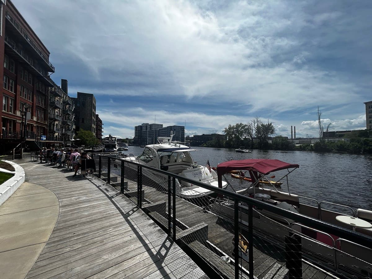 Boats and diners along the Milwaukee Riverwalk in the Historic Third Ward