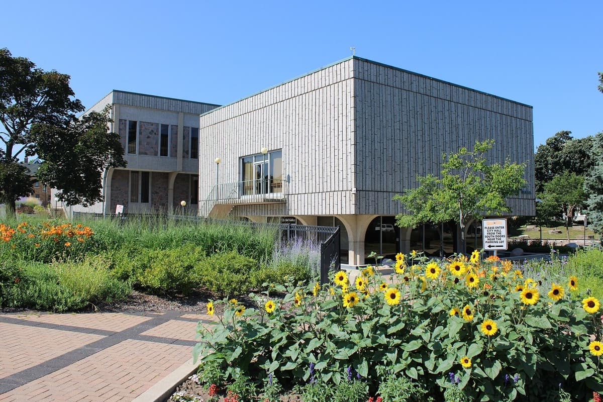 West Allis City Hall with garden flowers in bloom